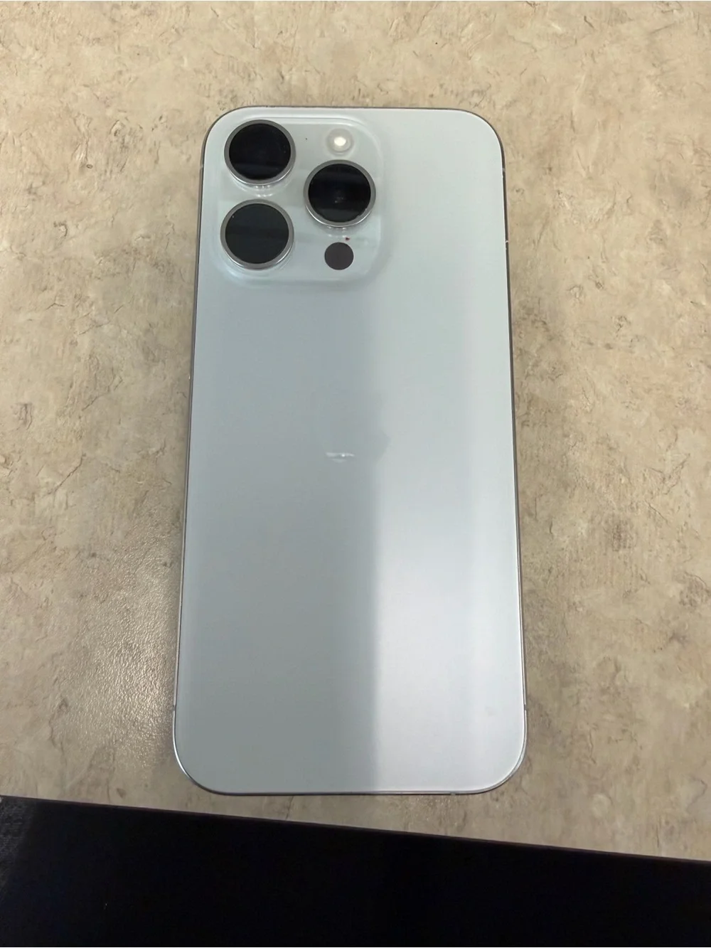 Apple iPhone 15 pro in White with Silver Frame with triple 256 GB
